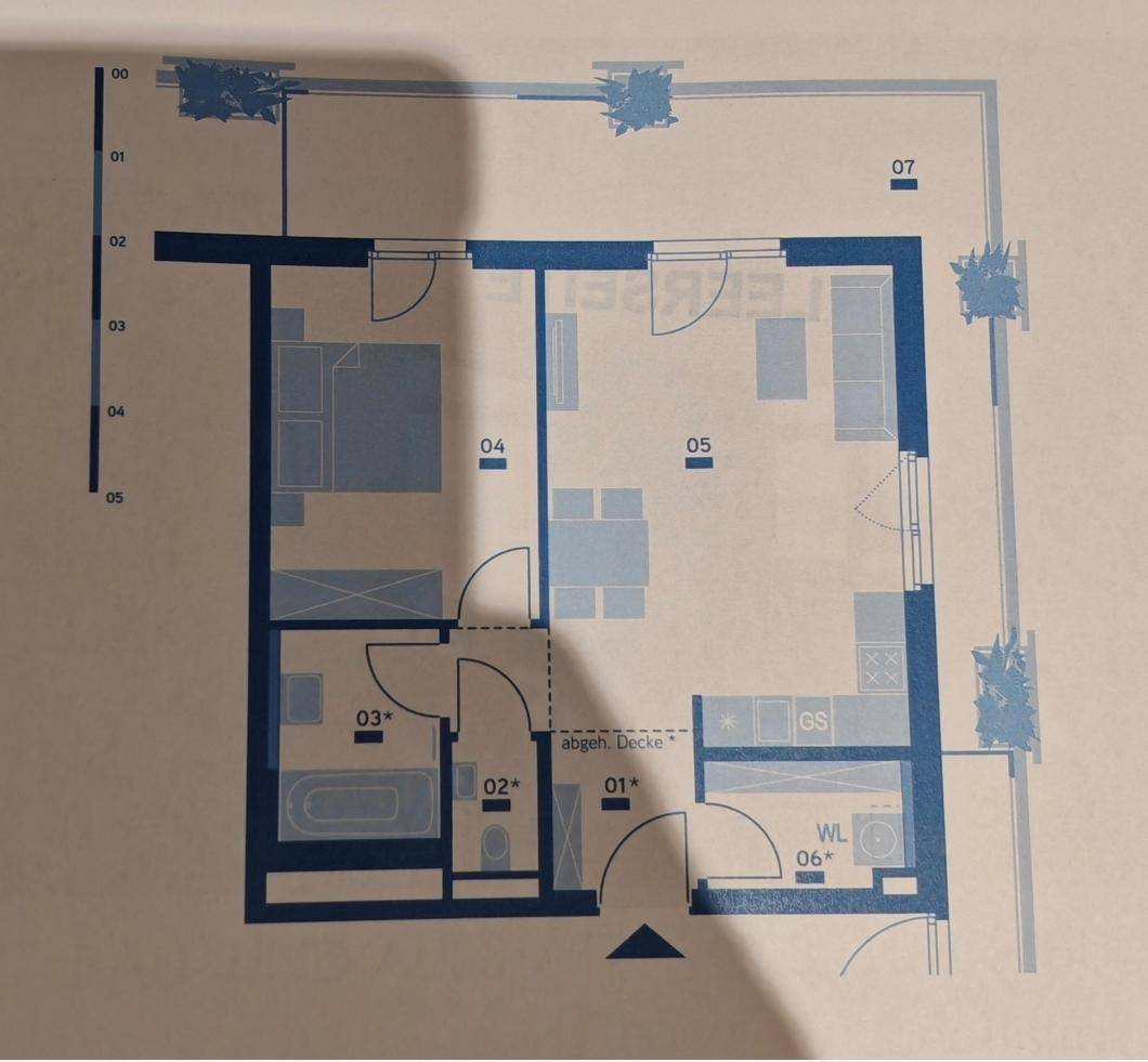 Detaillierter Grundriss einer Wohnung mit Schlafzimmer, Bad, Küche und Balkon.