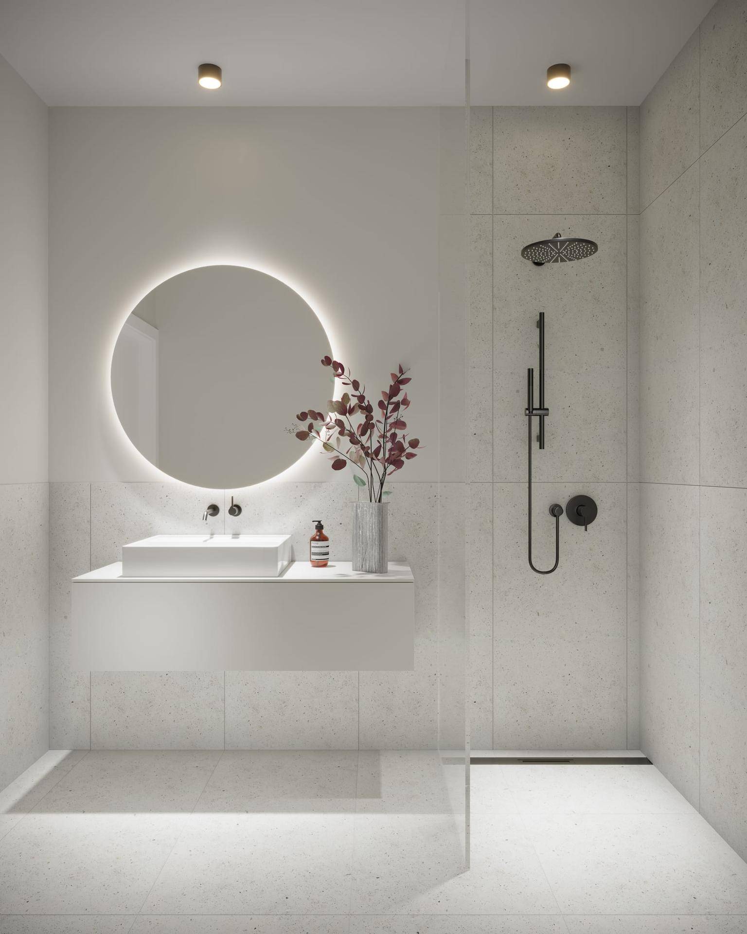 Elegantes Badezimmer mit beleuchtetem Spiegel, schwebendem Waschtisch und begehbarer Dusche.