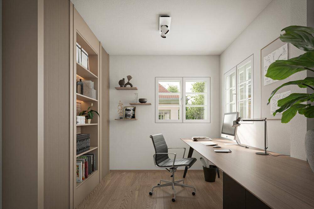 Helles Arbeitszimmer mit modernem Schreibtisch, integriertem Regal und Blick ins Grüne.