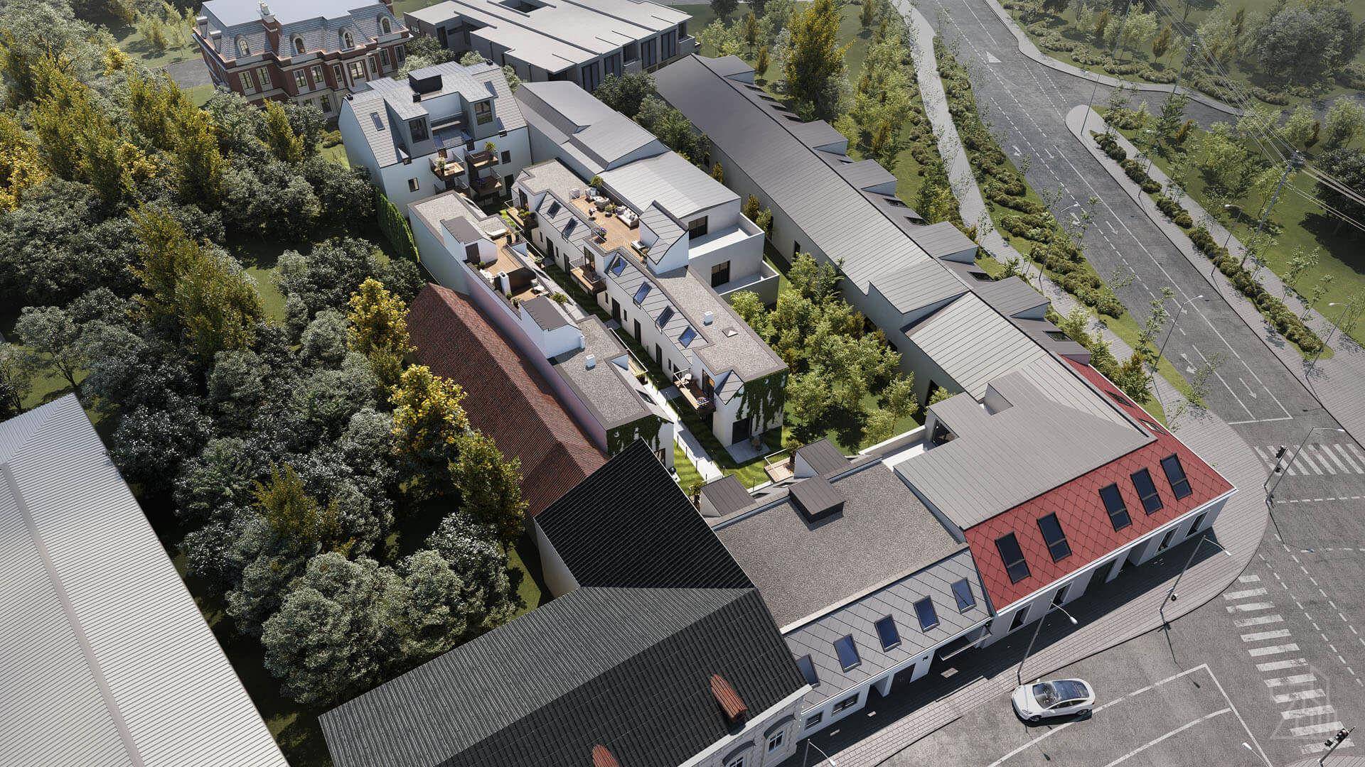 Luftaufnahme der Wohnanlage, eingebettet in eine grüne Umgebung mit angrenzenden Gebäuden und Straßen.
