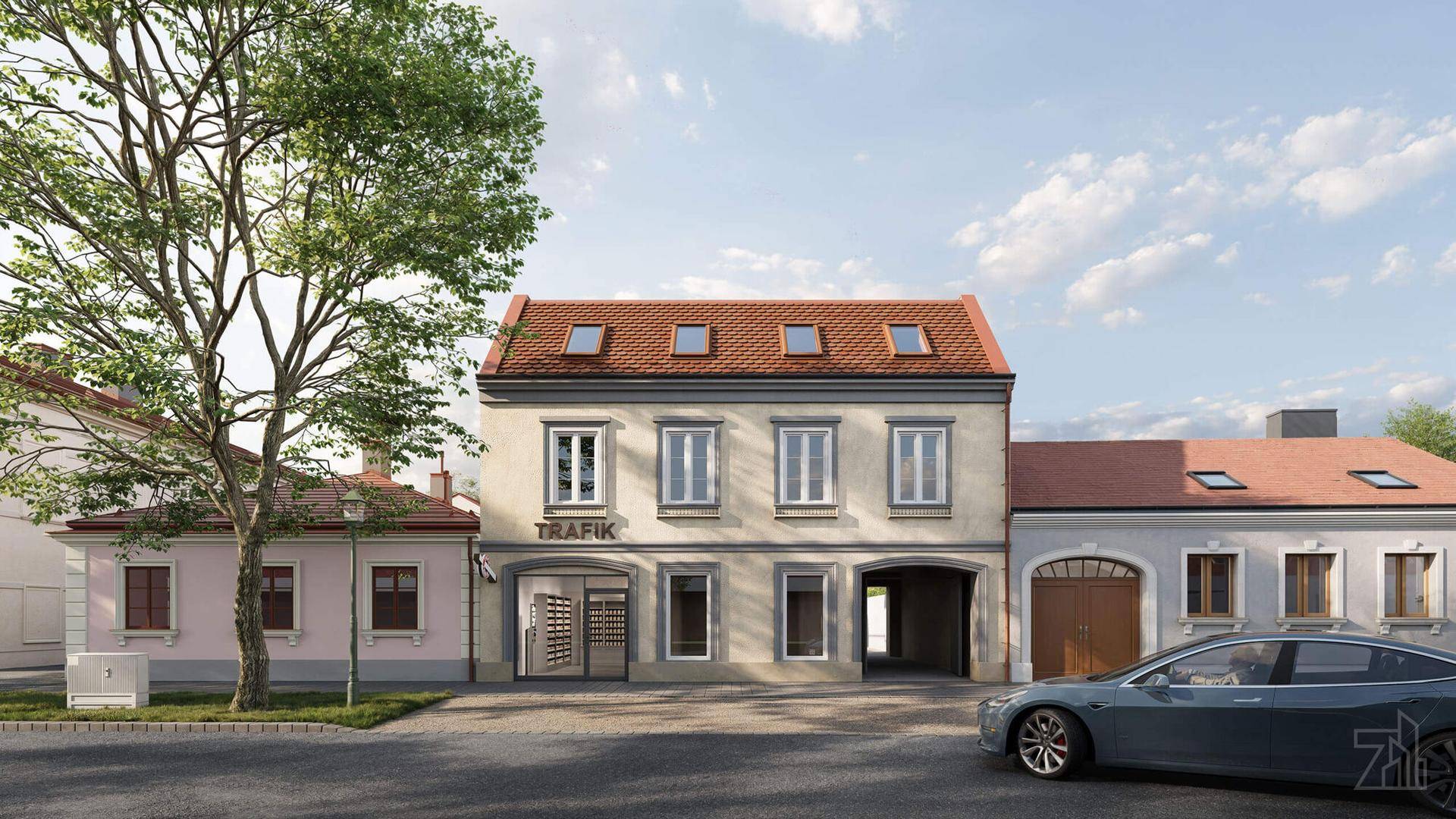 Traditionelles Gebäude mit Geschäft im Erdgeschoss und Mansarddach in städtischer Umgebung.