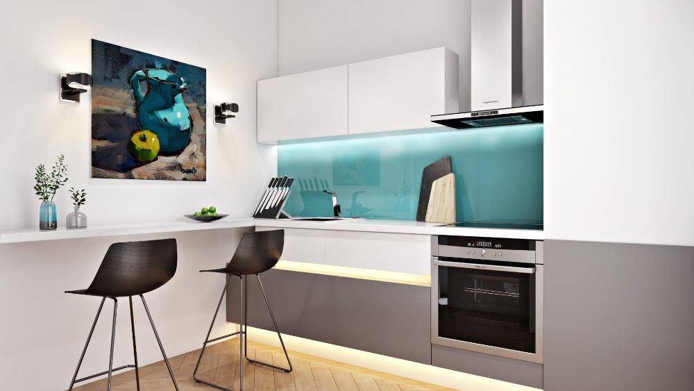 Moderne Küche mit weißer Arbeitsplatte, blauer Rückwand und integriertem Backofen.