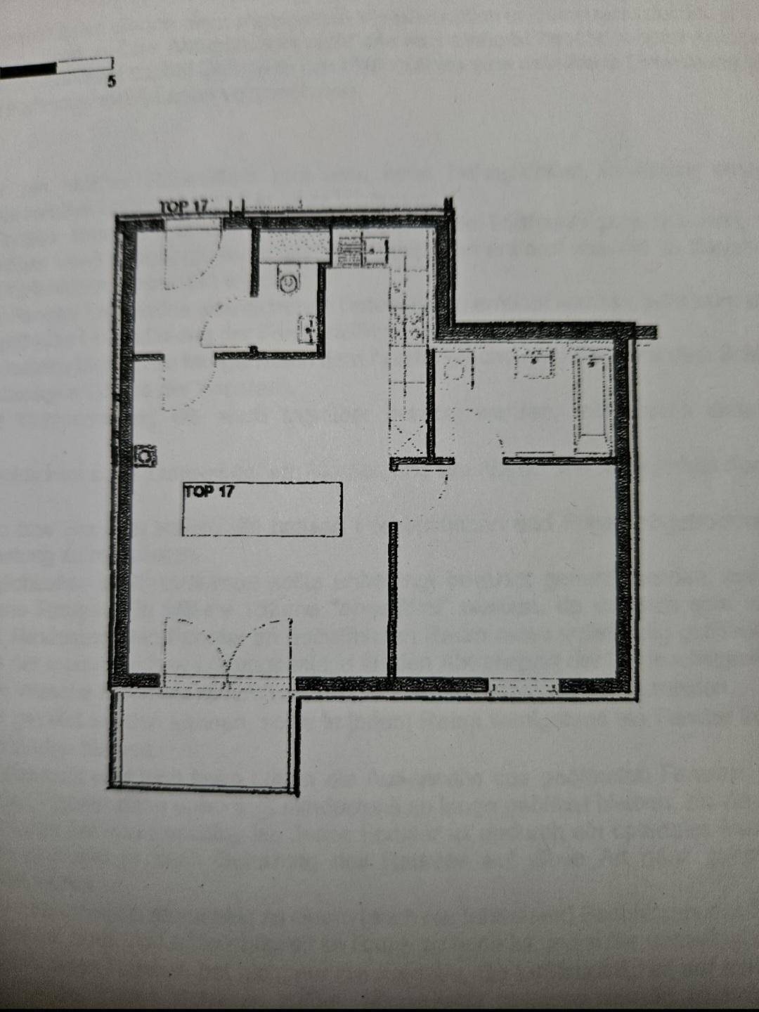 Grundriss der Wohnung TOP 17 mit Küche, Bad, WC, zwei Zimmern und Balkon.