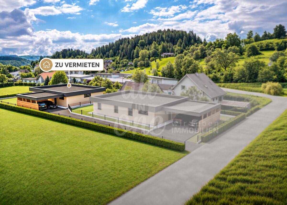 Überblick über die moderne Wohnsiedlung mit Einfamilienhäusern und Carports in grüner Hügellandschaft.