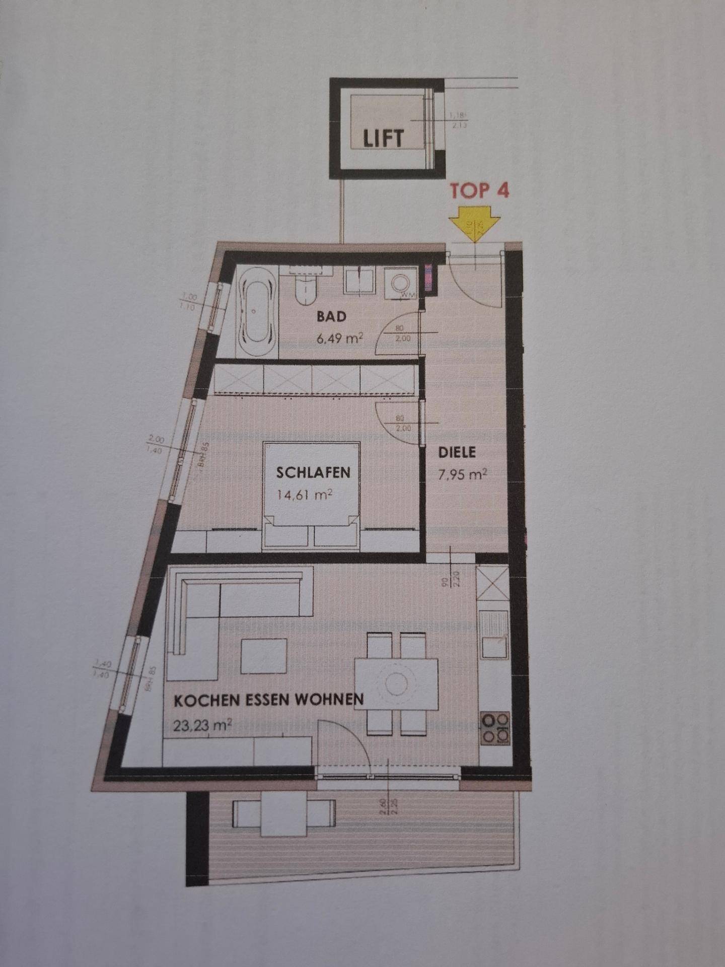 Grundriss einer Wohnung mit offenem Wohn-, Ess- und Kochbereich sowie Balkon.