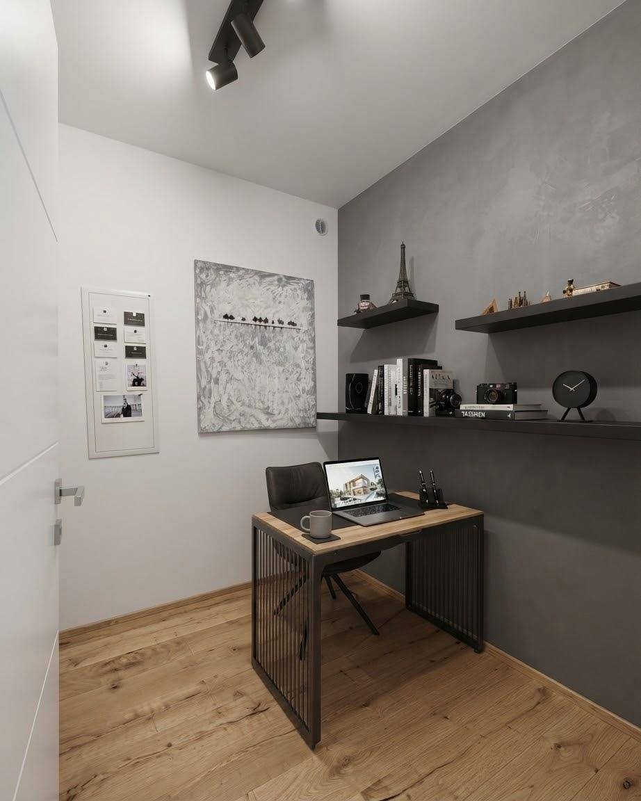 Kompaktes Arbeitszimmer mit Holzboden, modernem Schreibtisch und Wandregalen.