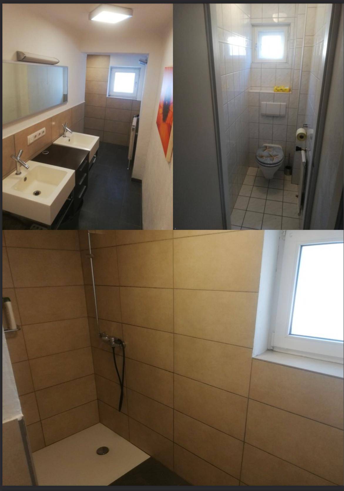 Badezimmer mit Doppelwaschbecken, separatem WC und Duschbereich, alle mit Fenstern.